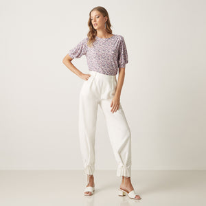 Max lavender floral top full length on model with white trousers