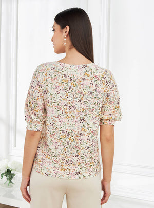 Floral print puff sleeve top back view on model
