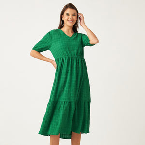 Max emerald green textured tiered dress back view on model