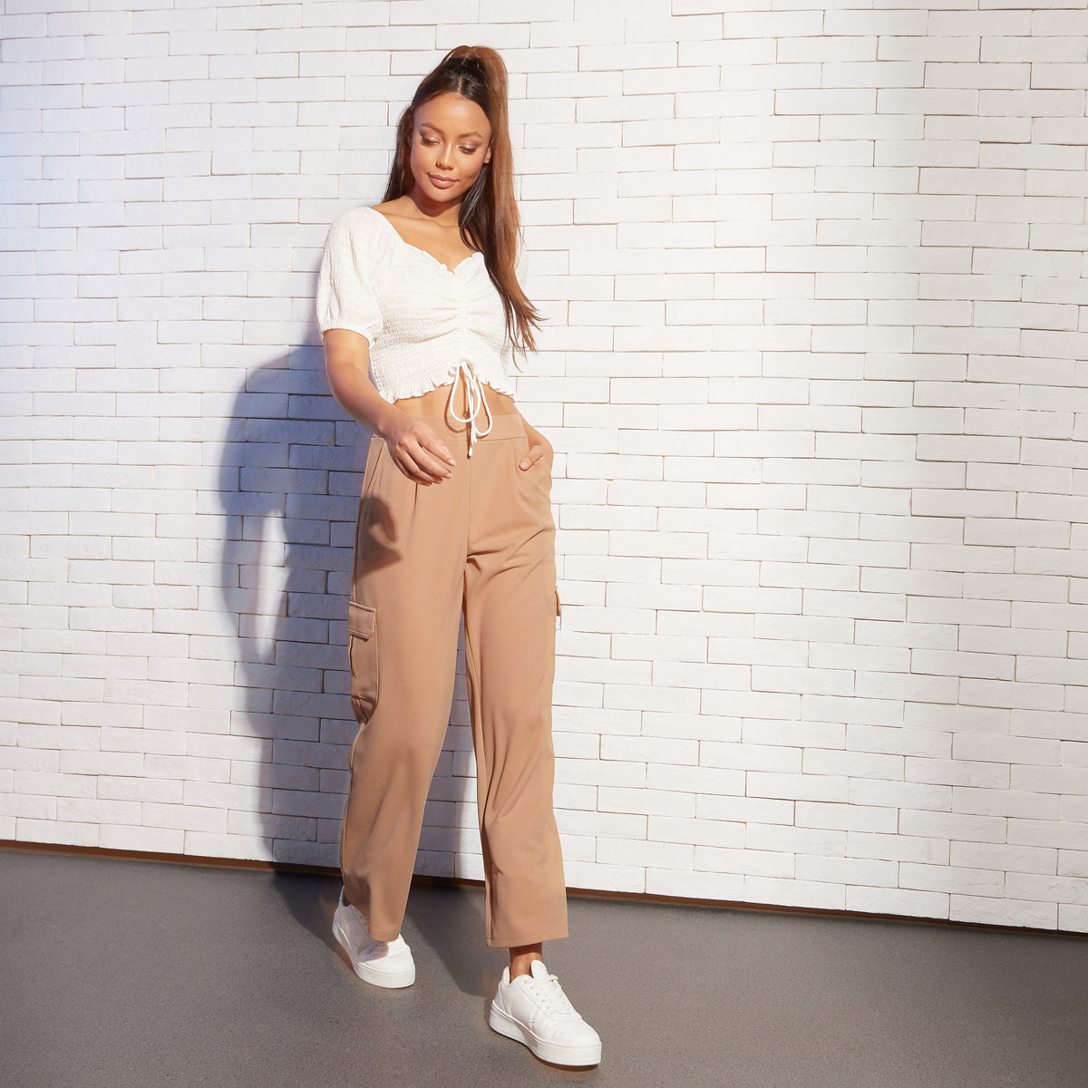 Max white ruched crop top full length on model with camel cargo trousers and white sneakers