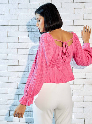 Max pink crinkle peplum top close-up of flounce cuff and crinkle texture detail