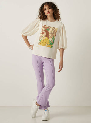 Max graphic print top side view on model with lilac trousers