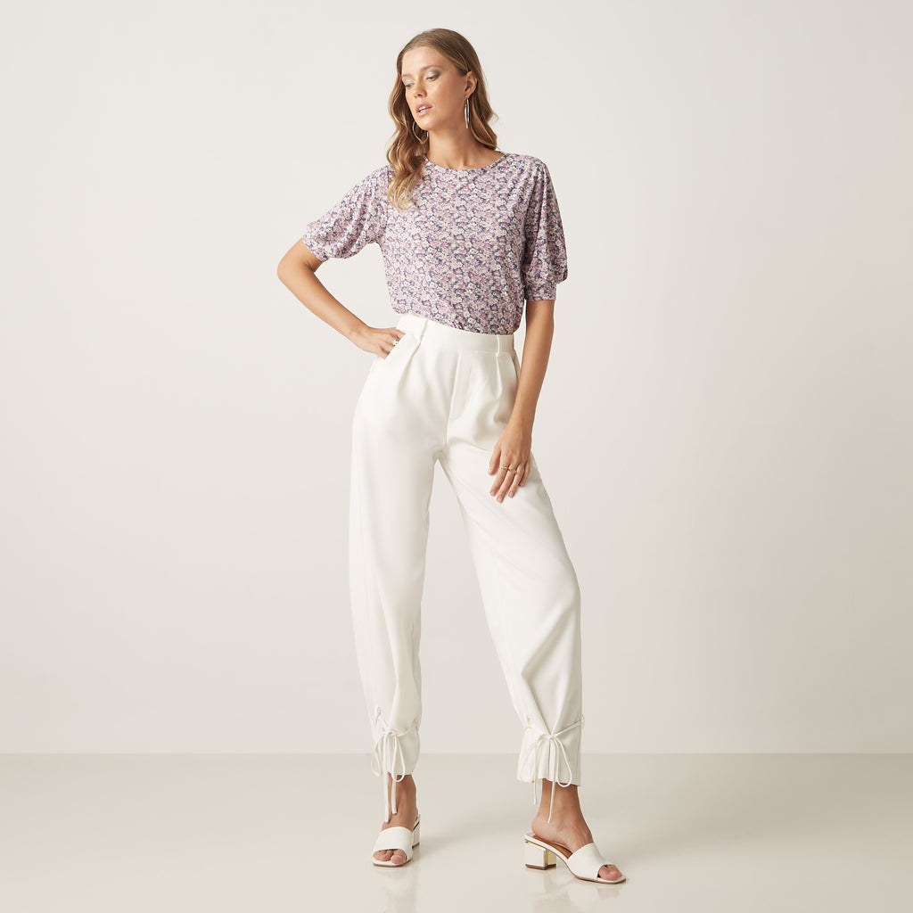 Max lavender floral top full length on model with white trousers
