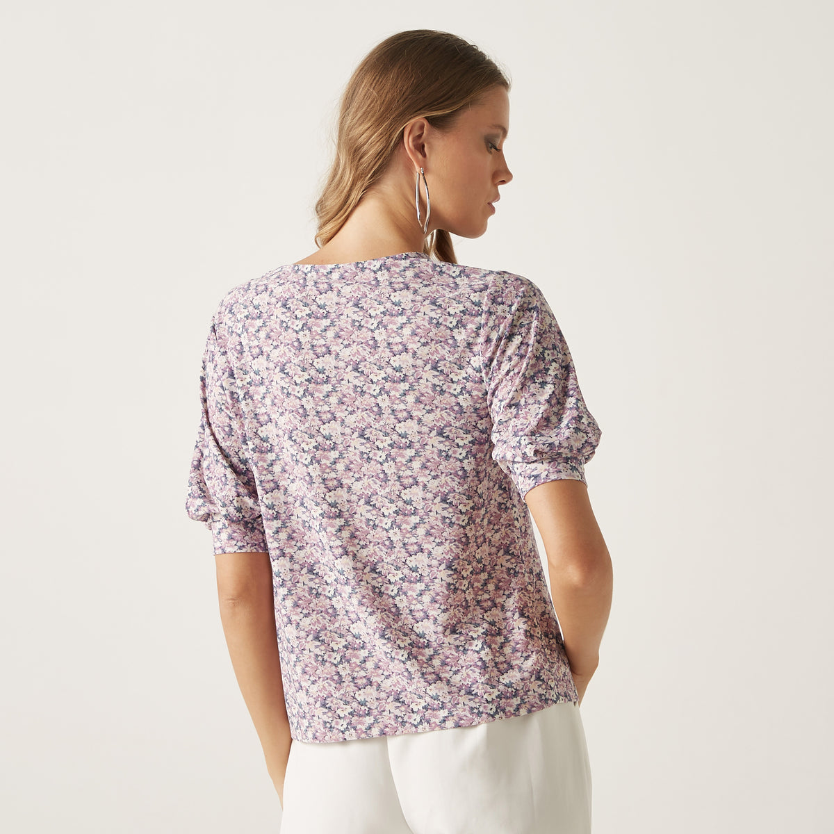 Max lavender floral top back view on model