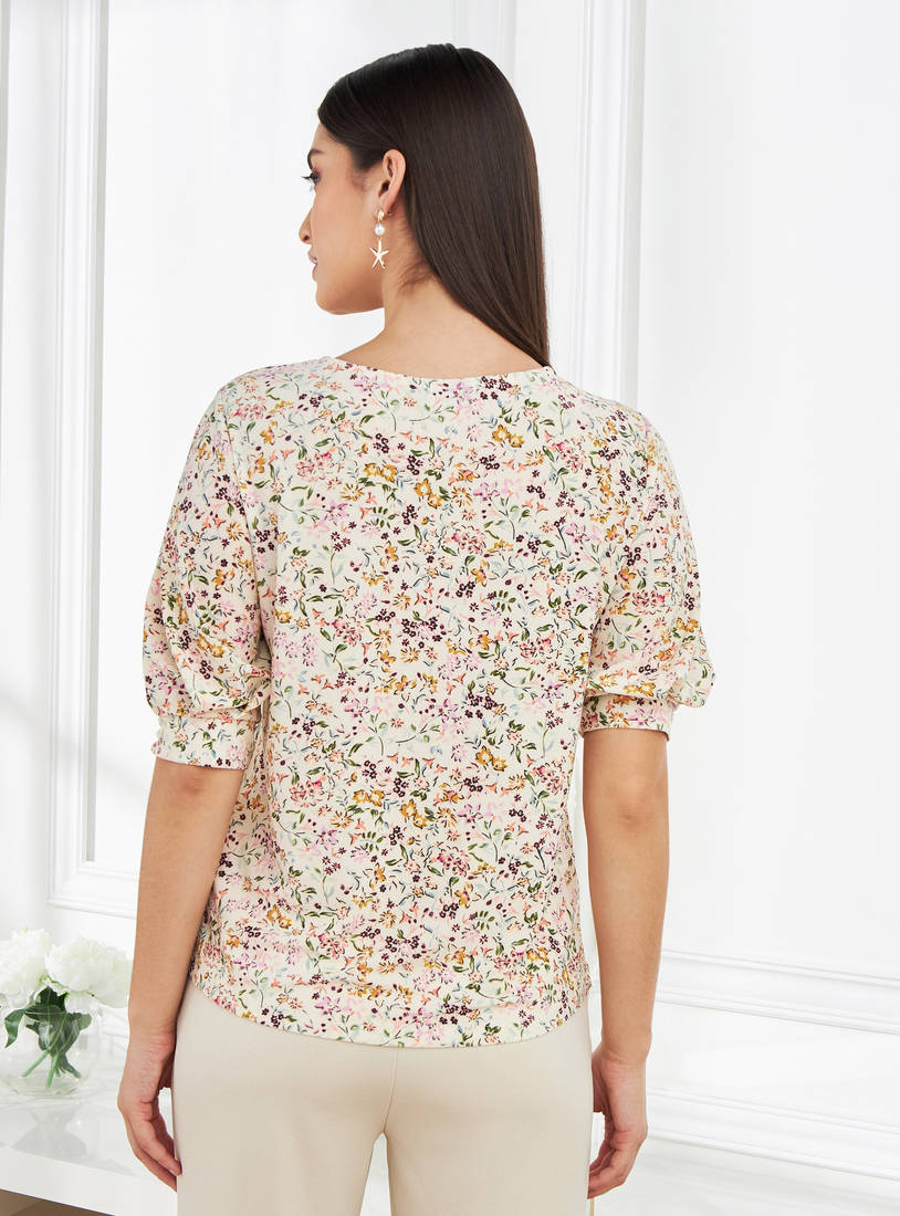Floral print puff sleeve top back view on model