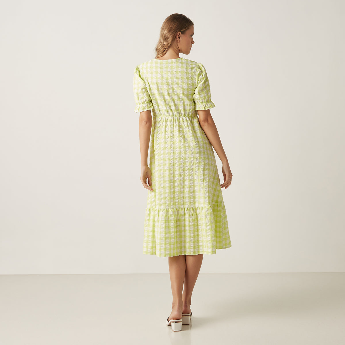 Max lime green gingham wrap dress three-quarter view on model