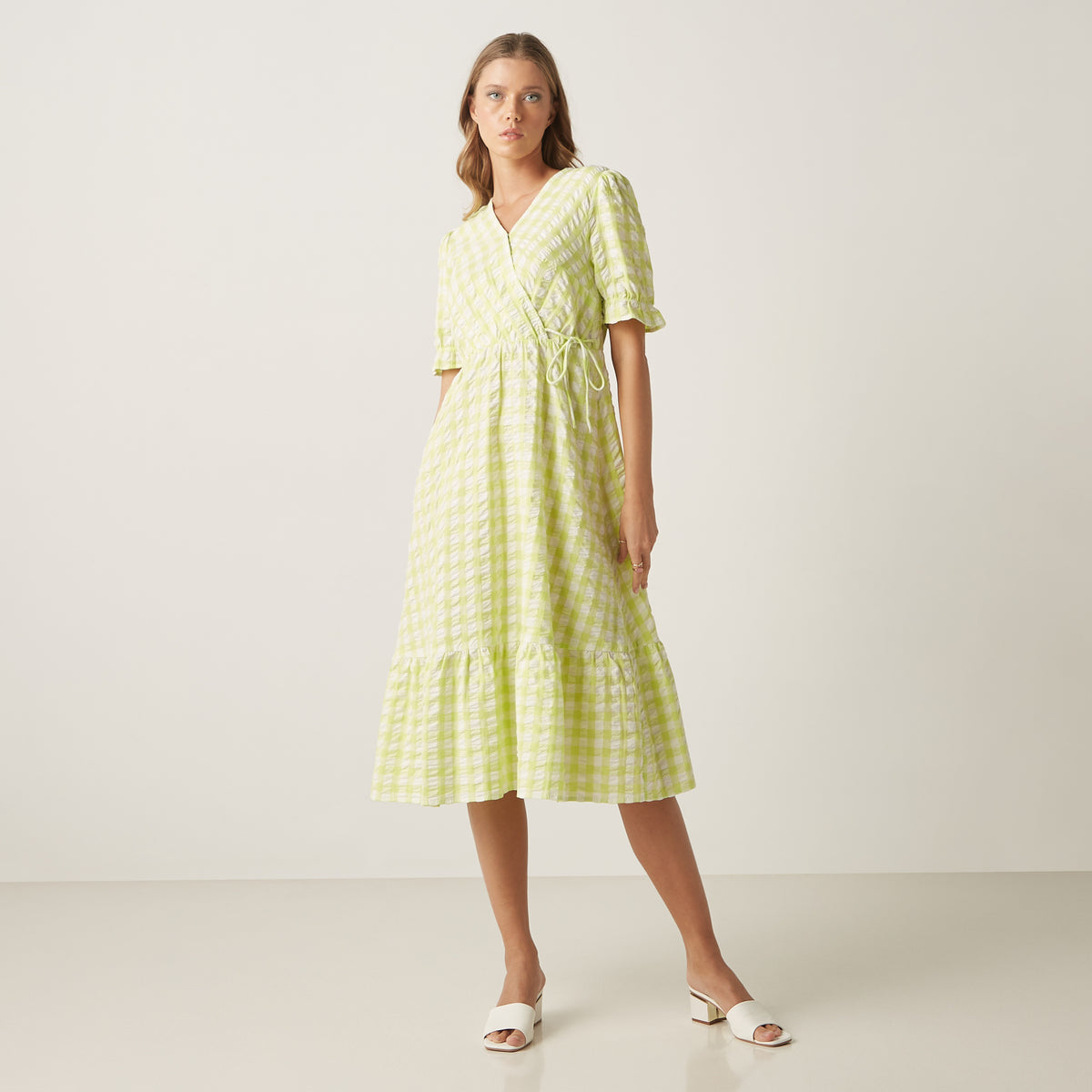 Max lime green gingham wrap dress close-up of V-neck wrap and tie-up waist detail