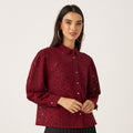 Max wine burgundy floral lace puff sleeve shirt front view on model with black pleated skirt