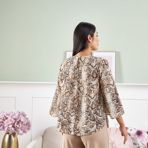 Max animal print pintuck top back view on model