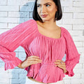 Max pink crinkle peplum top front view on model