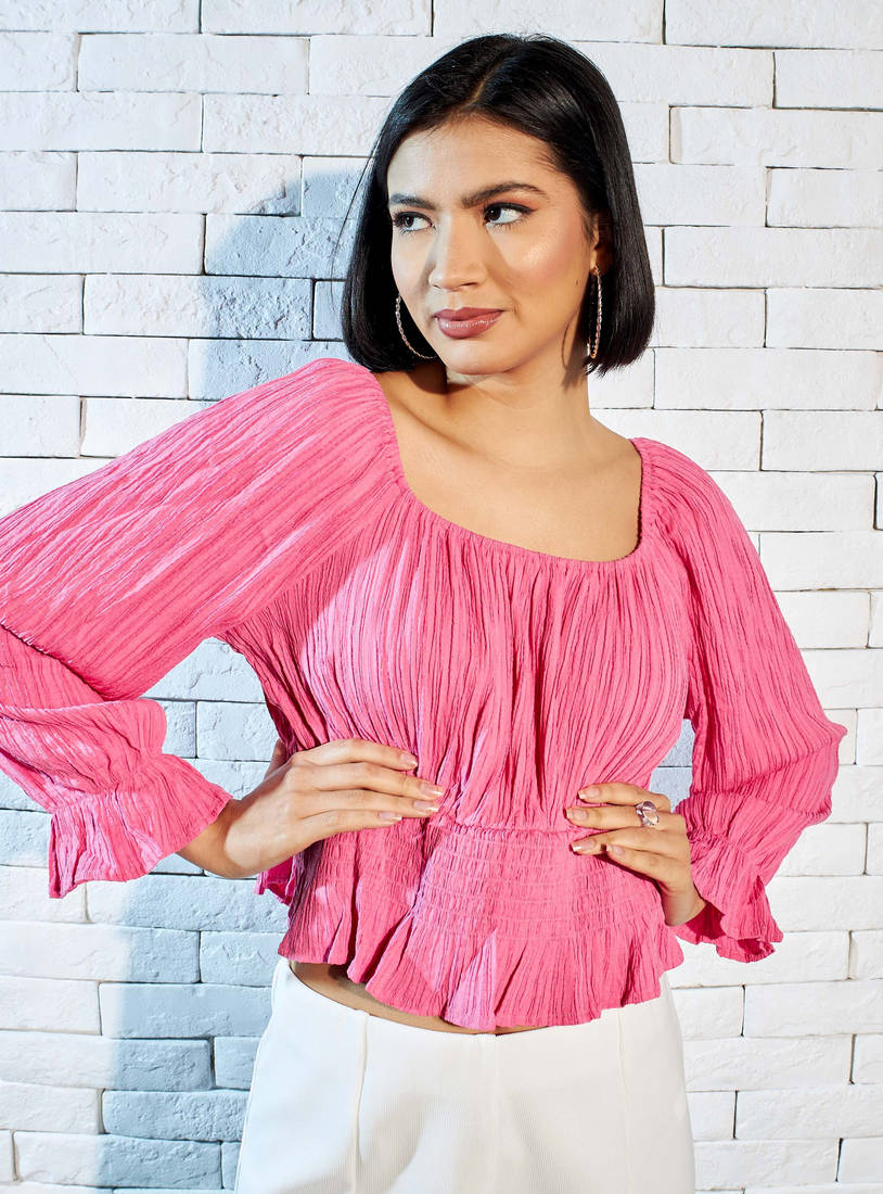 Max pink crinkle peplum top front view on model