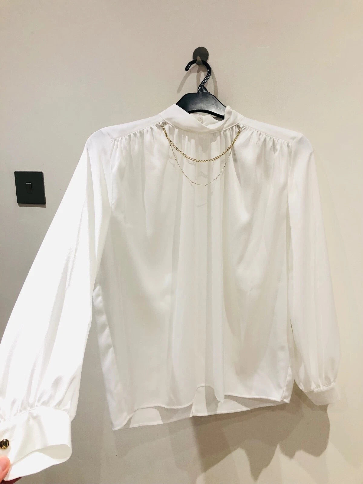 Zara white satin blouse front on hanger 2
